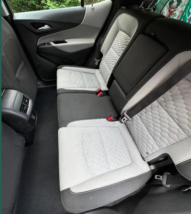 Same vehicle rear seat and floor cleaned after interior detailing
