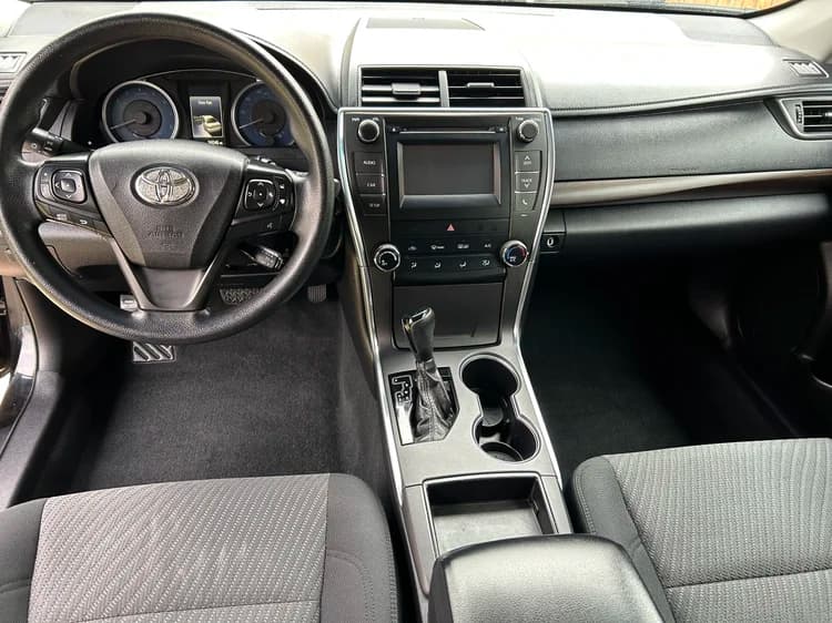 Clean Toyota dashboard, center console, seats, and footwells after detailing