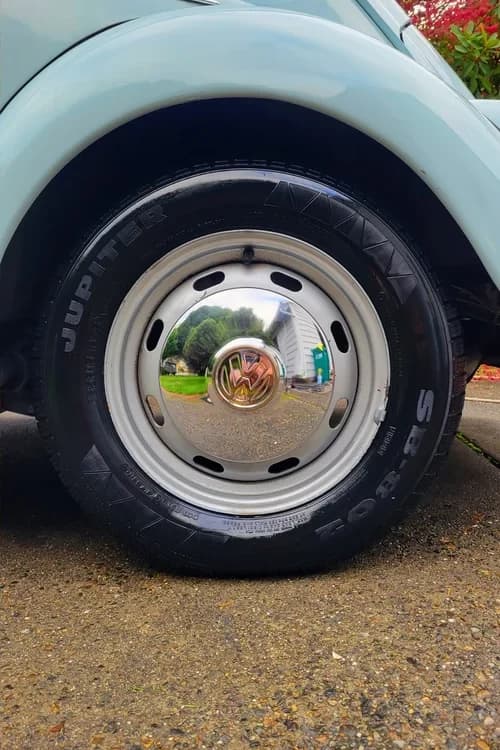 Same Volkswagen wheel and tire clean after detailing